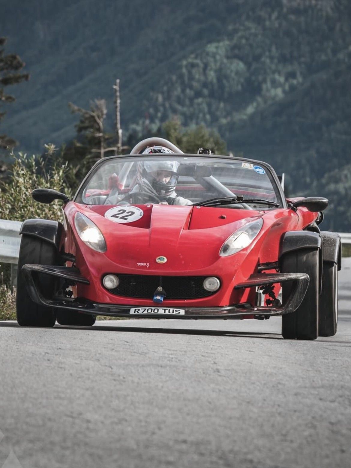 Red Lotus 340R on a mountain road, seen head-on